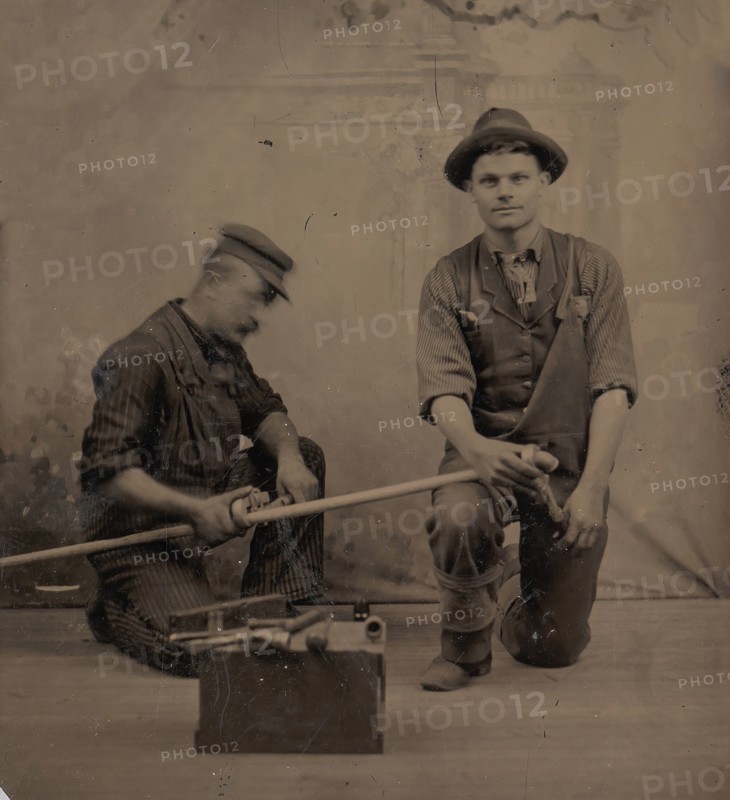 Two Plumbers with a Pipe, Pipe Cutter, and Toolbox, 1870s-80s.