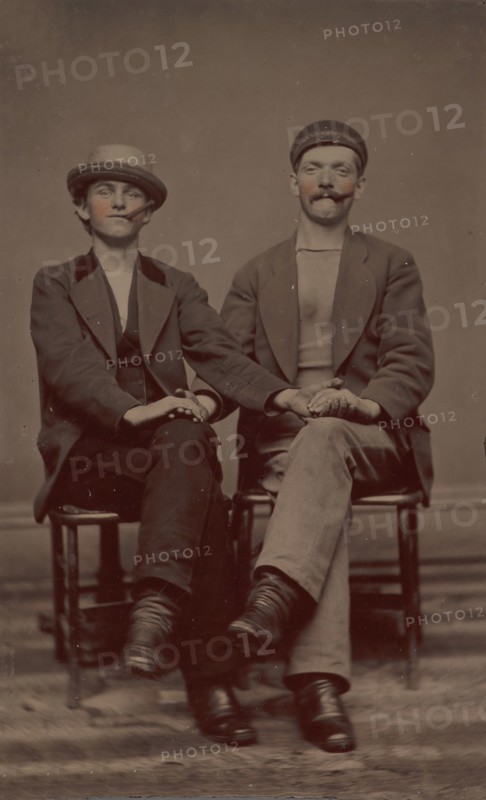 Two Seated Young Men Holding Hands, 1880s.