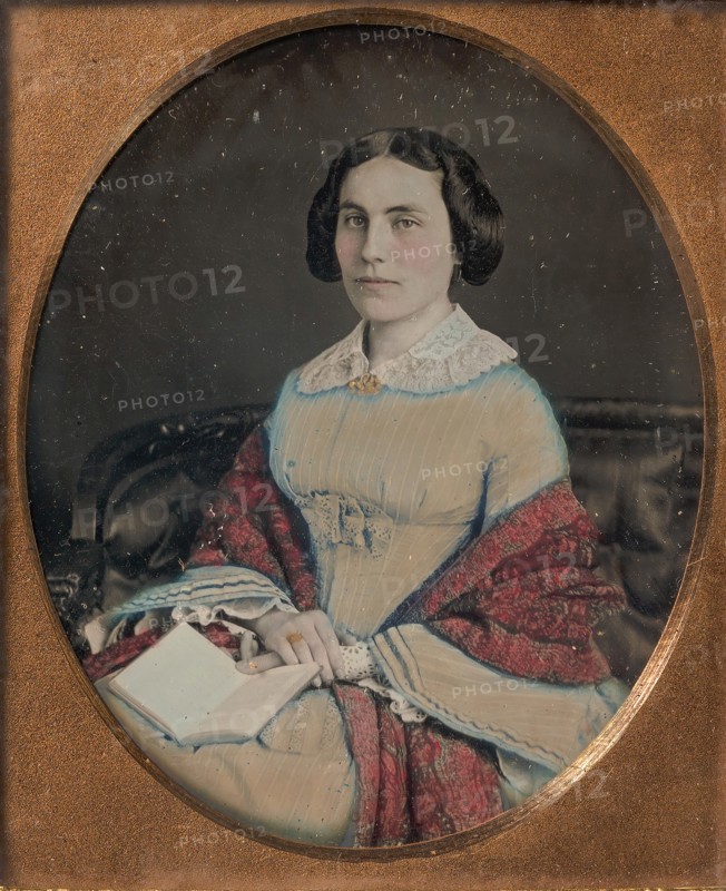 Seated Young Woman Wearing a Shawl, Holding an Open Book in her Lap, 1850s.