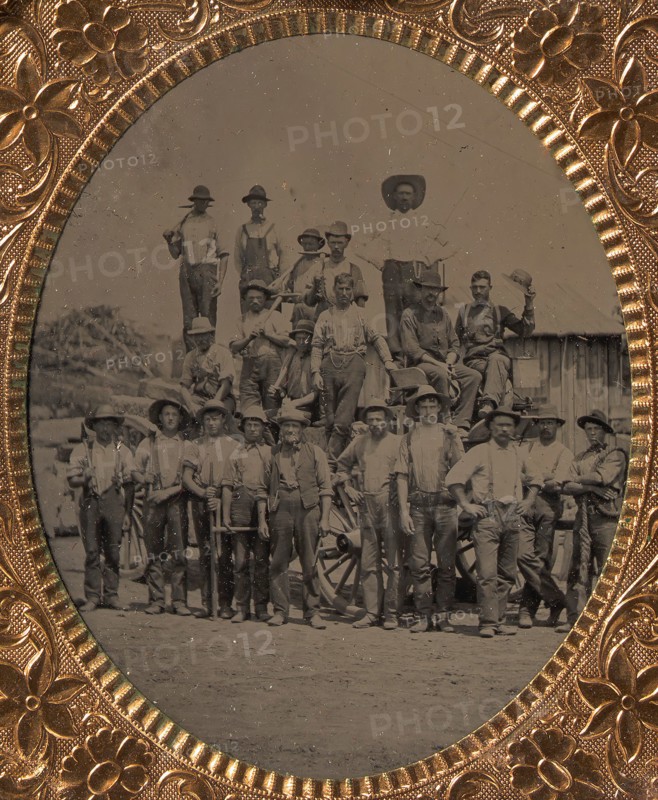 Crew of Twenty-one Workmen Posing With Tools Outdoors, 1860s-80s.