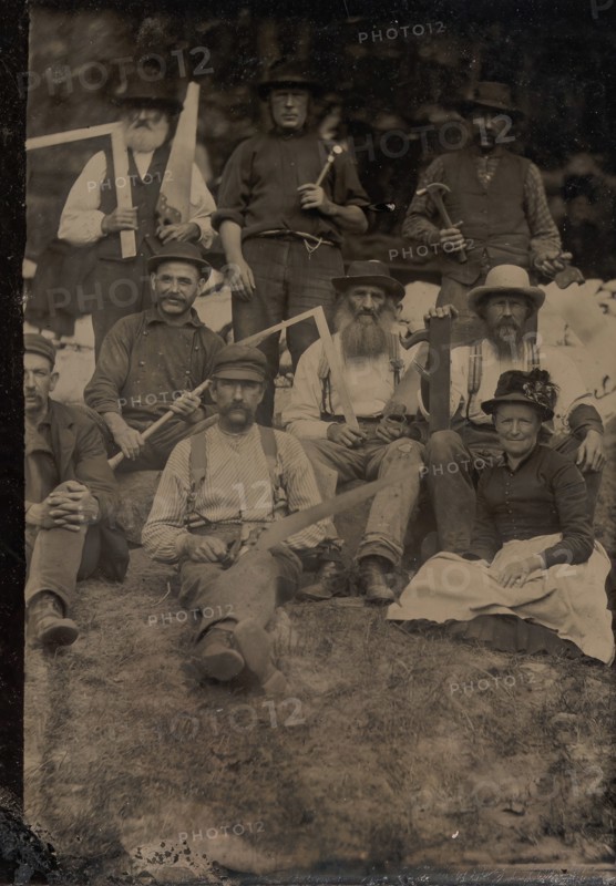A Woman and Eight Carpenters Posed Outdoors, 1880s.