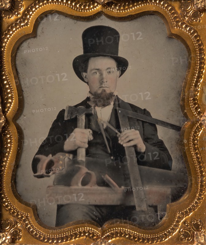 Carpenter in Top Hat with Hatchet, Compass, Square, and Hand Saw, 1850s-60s.