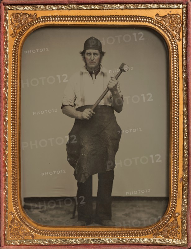 Man Gripping Sledgehammer, Wearing Leather Half Apron and Cap, 1850s-60s.