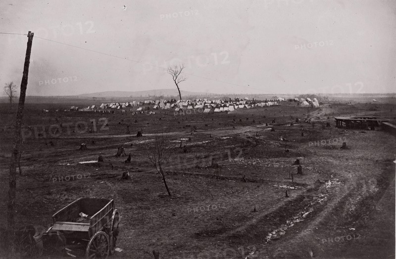 [Wagon in a landscape with army encampment in the distance]. Brady album, p. 125, 1861-65. Formerly attributed to Mathew B. Brady.