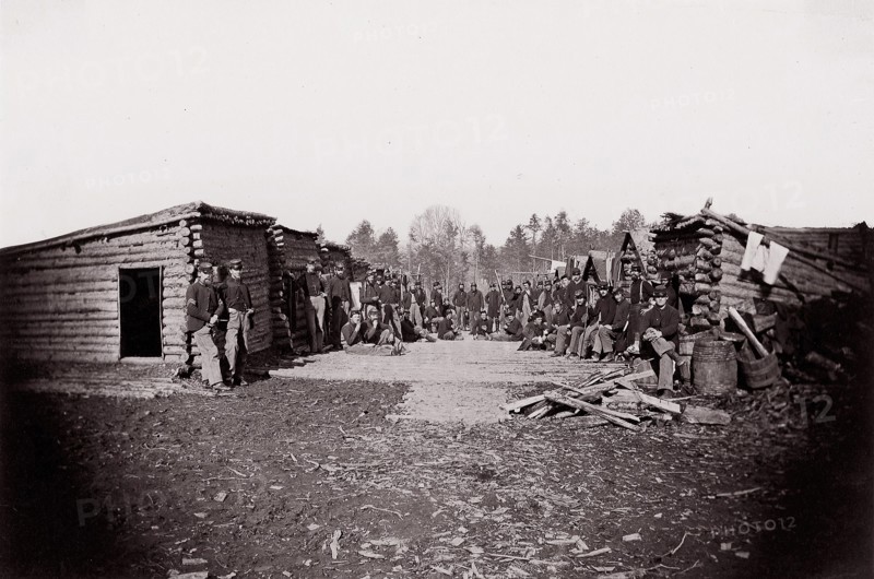 [Winter Quarters, troops with row of cabins]. Brady album, p. 128, 1861-65. Formerly attributed to Mathew B. Brady.