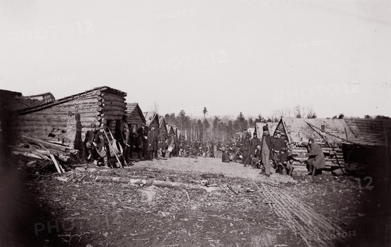[Winter Quarters, troops with row of cabins]. Brady album, p. 128, 1861-65. Formerly attributed to Mathew B. Brady.