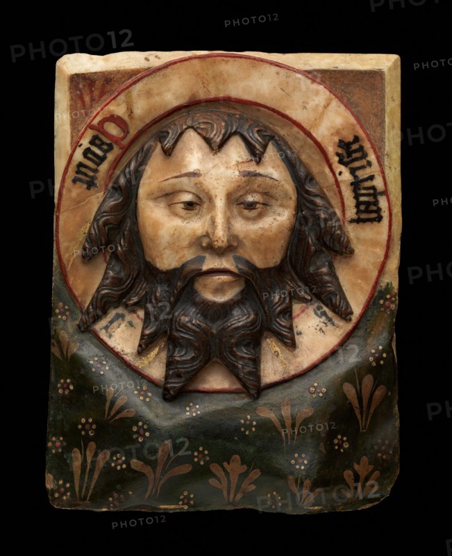 Plaque with the Head of Saint John the Baptist on a Charger, British, 15th century. This relief depicts the relic of John's head, which was kept in Amiens Cathedral.