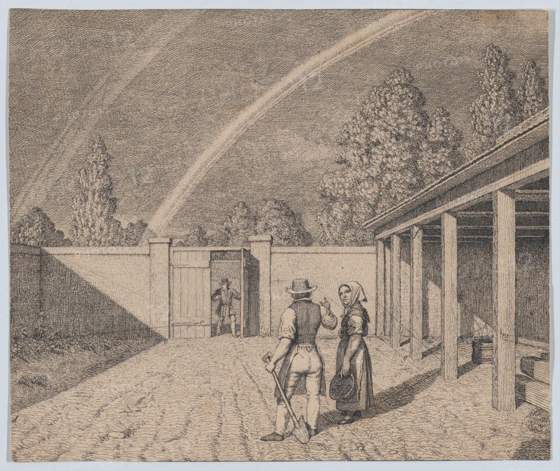 A couple conversing in a stable yard