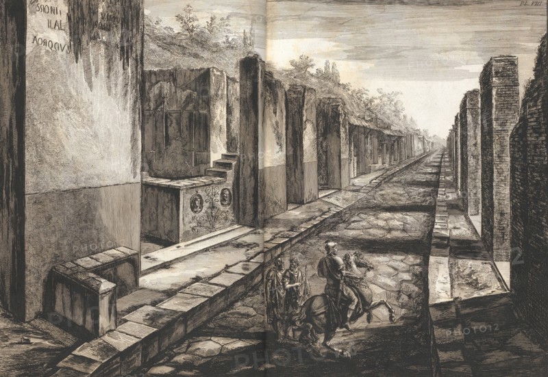 View from the street entering beneath the gateway to the city of Pompeii