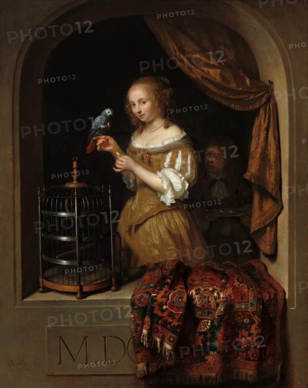 A Woman Feeding a Parrot, with a Page, 1666.