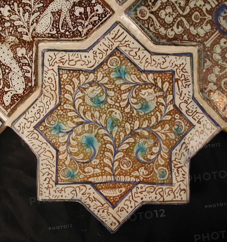 Star-Shaped Tile, Iran, 13th-14th century. Waq-waq design of plant whose tendrils develop into heads of animals with text from the Shahnama in which Rustam, one of the tale?s great heroes, is engaged in battle. from an Ilkhanid building.