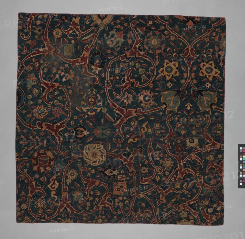 Blue-ground Carpet Fragment with Scrolling Floral Vines, Iran, 17th century.