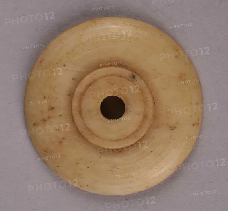 Spindle Whorl, Iran, 9th-10th century.  Excavated at Nishapur, providing evidence the city possessed a thriving textile industry