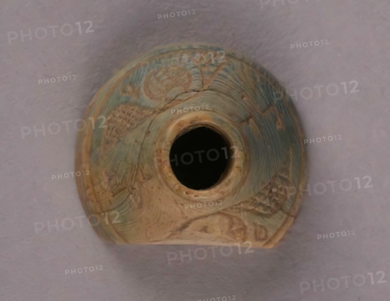 Spindle Whorl, Iran, 9th-10th century.  Excavated at Nishapur, providing evidence the city possessed a thriving textile industry.