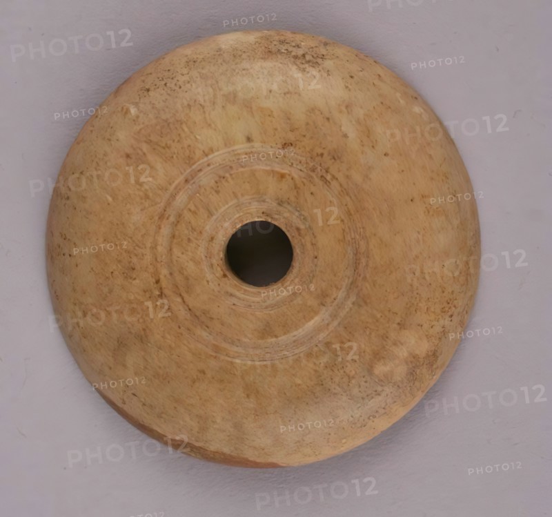 Spindle Whorl, Iran, 9th-10th century.  Excavated at Nishapur, providing evidence the city possessed a thriving textile industry.