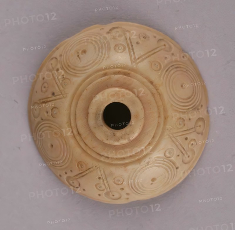 Spindle Whorl, Iran, 9th-10th century.  Excavated at Nishapur, providing evidence the city possessed a thriving textile industry