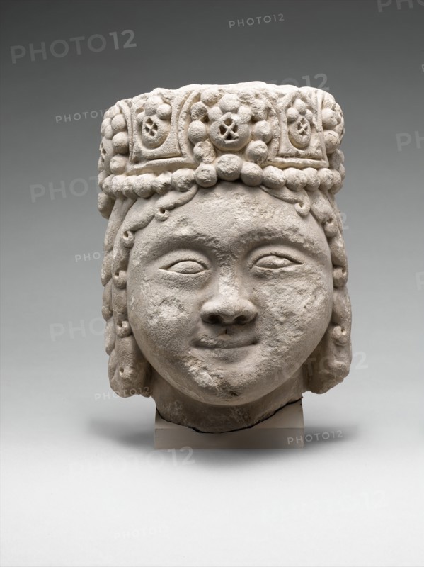 Head from a Figure with a Beaded Headdress, Iran, 12th-early 13th century. rare example from the Seljuq period.