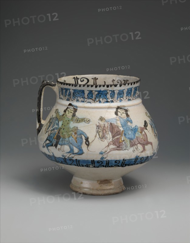 Ewer with Horsemen Inscribed in Arabic with Good Wishes to its Owner, Iran, second half 12th-early 13th century. Horsemen in procession between two rows of kufic inscription. Mina?i production.