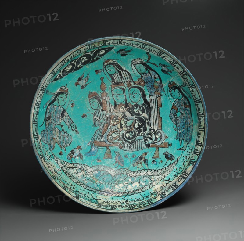 Bowl with a Majlis Scene by a Pond, Iran, dated A.H. 582/ A.D. 1186. Abu Zayd, a proficient poet, composed at least one of the love poems inscribed on this bowl.