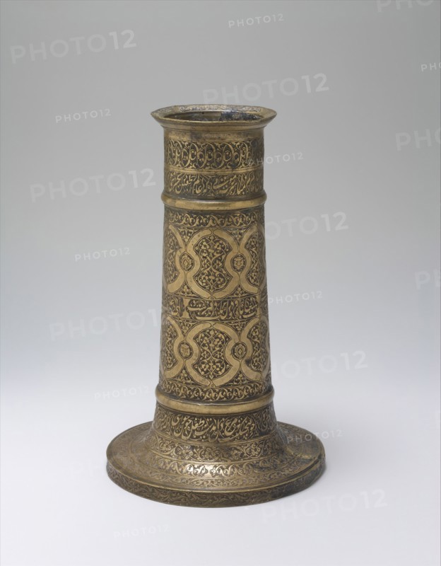 Engraved Lamp Stand with Interlocking Circles, Iran, probably 16th century. Verses embody spiritual metaphors . I said to the candle: "What is this moth around your face?" It said: "I am the sultan of beauty what is the desire of the moth?" by by Saadi
