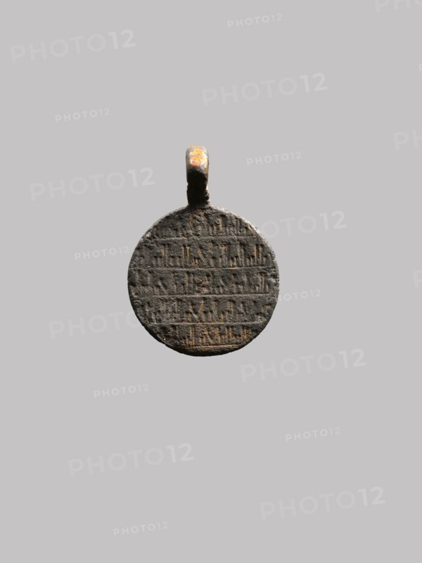 Pendant with Lion and Scorpion, Iran, 10th century.  Believed to be a talisman