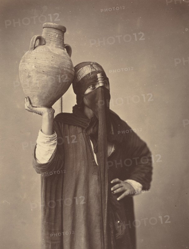 Porteuse d'eau au Caire [Water Carrier in Cairo], c. 1870.