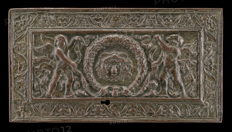 Cover of a writing casket: Geniuses with Wreath and Medusa Head, c. 1500.