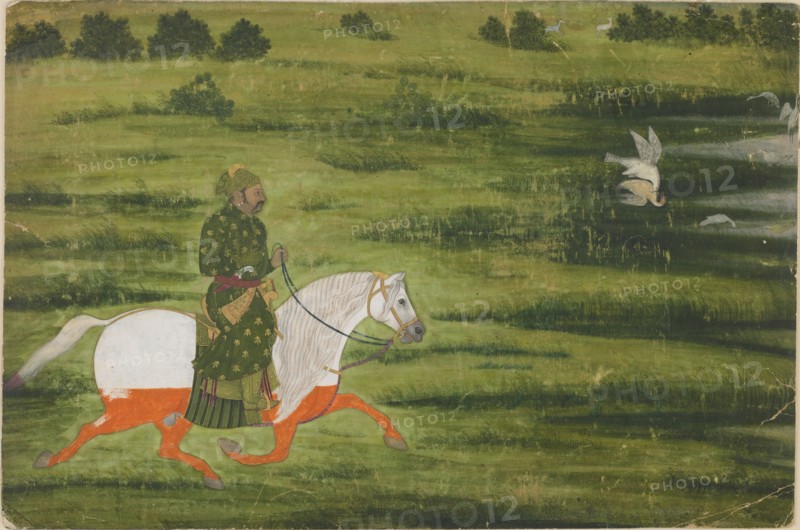 A mounted man hunting birds with a falcon, early 18th century.