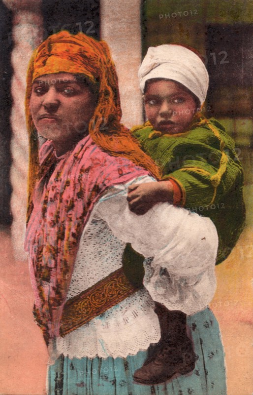 Mother and child, Tangier, 1932. Moroccan woman carrying her baby.