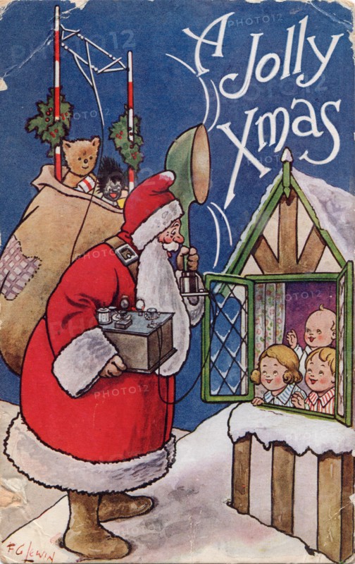 A Jolly Xmas, 1934. Father Christmas holds a transmitter with loudspeaker and aerial.