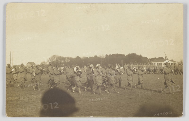 Photographic postcard of a military marching band, ca. 1917. Creator: Unknown.