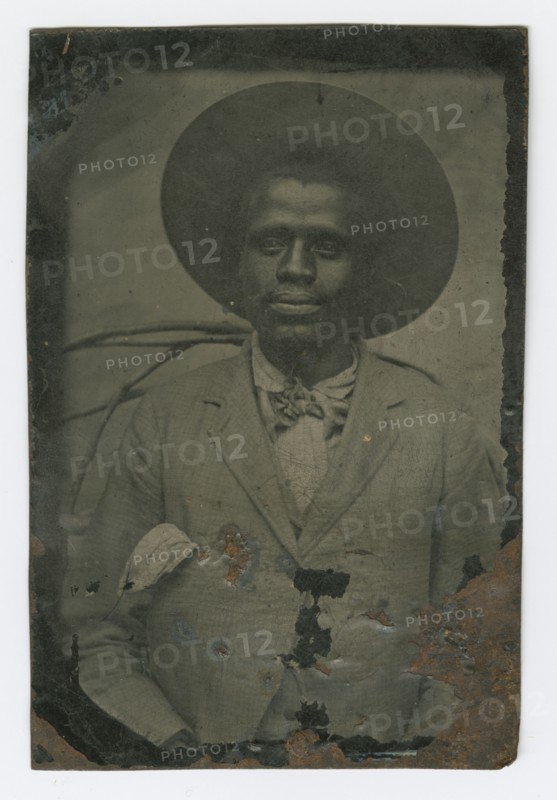 Tintype portrait of a man wearing a hat and suit, late 19th century. Creator: Unknown.