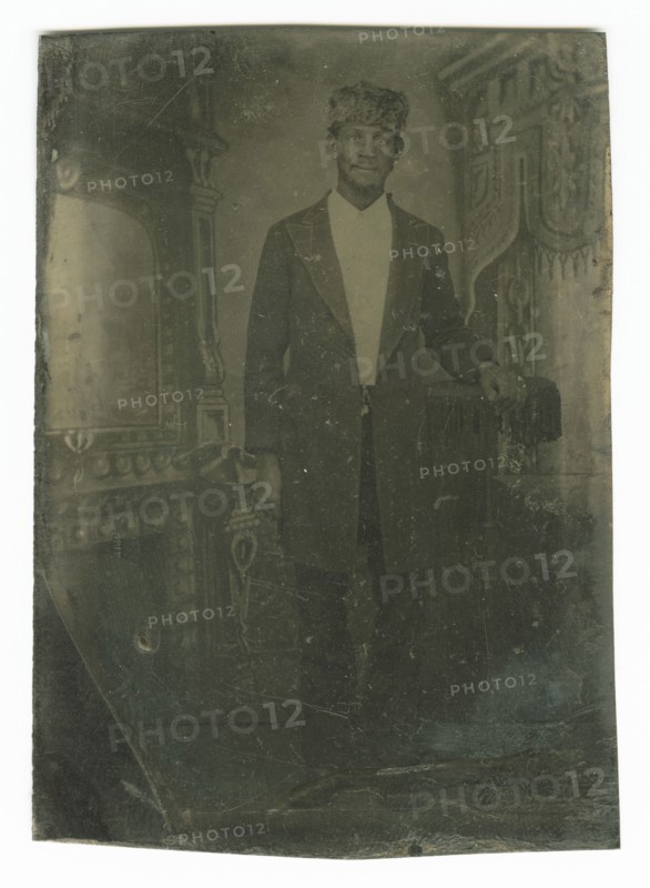 Tintype portrait of a man wearing a fur hat, late 19th century. Creator: Unknown.