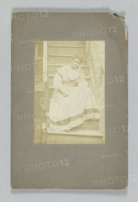 Albumen print of an unidentified woman sitting on stairs, 1850-1895. Creator: Unknown.