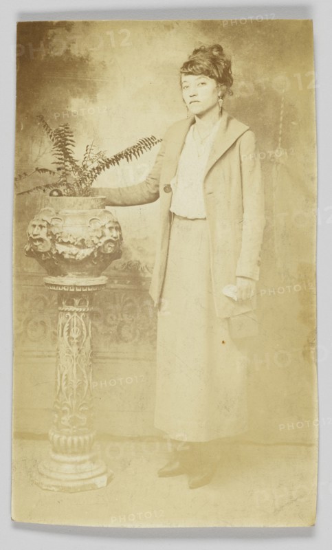 Photographic postcard of a woman, 1918-1930. Creator: The Rex Photo Studio.