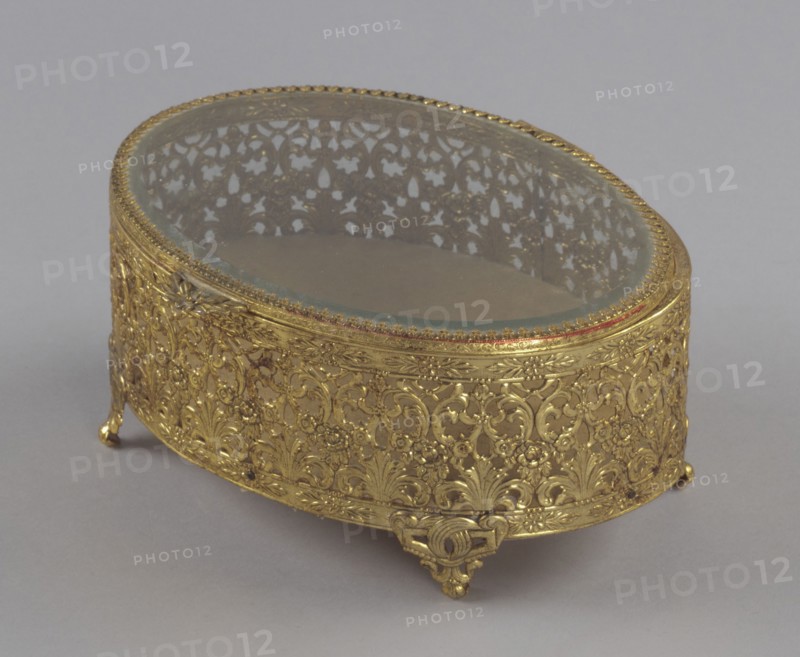 Gold metal scrollwork jewelry box from Mae's Millinery Shop, 1941-1994. Creator: Unknown.