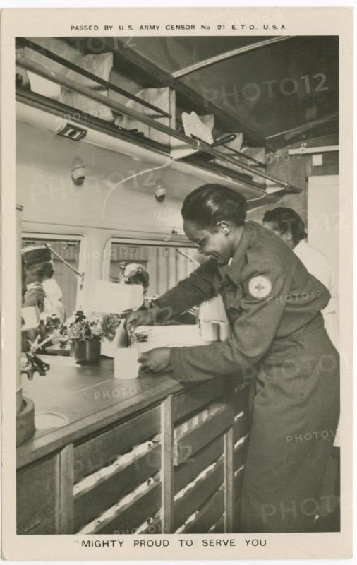 Picture postcard of a volunteer serving troops out of a Red Cross “Clubmobile", ca. 1945. Creator: Unknown.