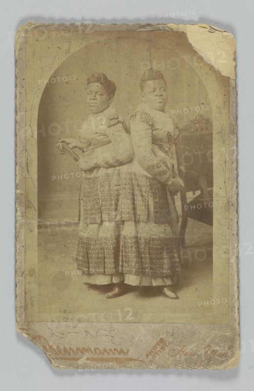 Albumen print of Millie and Christine McCoy, 1880s -1890s. Creator: Charles Eisenmann.