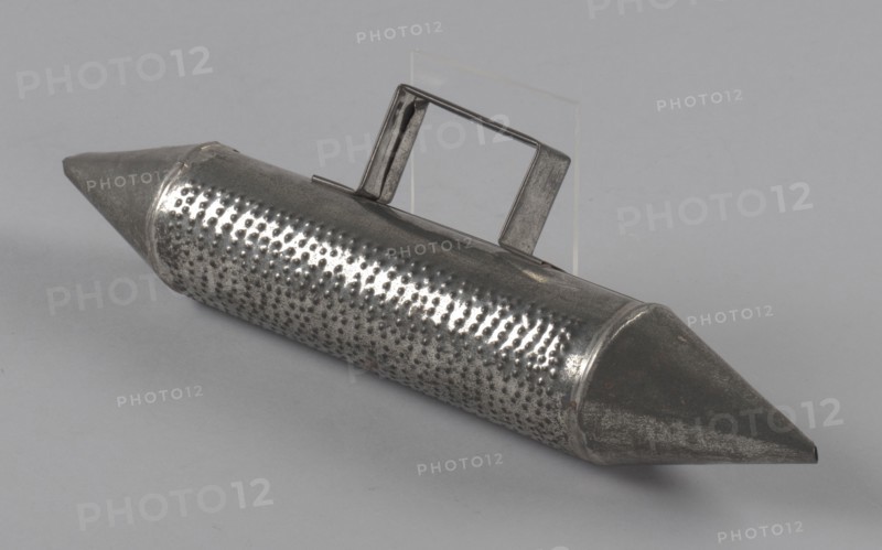 Costume oil can prop güira for Tin Man in The Wiz on Broadway, 1975. Creator: Fred Nihda.