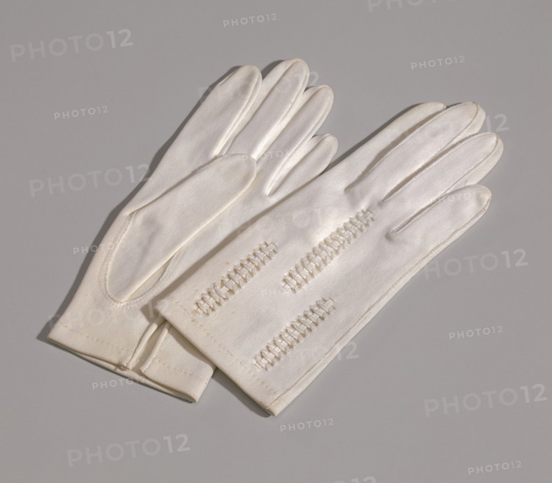 Pair of light cream gloves with openwork design from Mae's Millinery Shop, 1941-1994. Creator: Van Raalte.