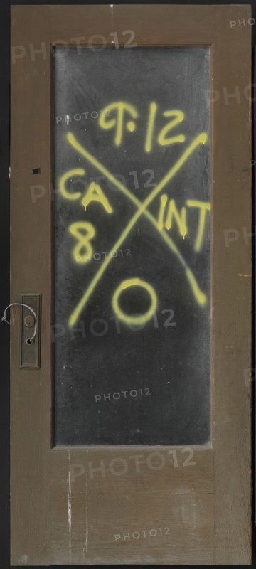 Door with rescue markings from Hurricane Katrina, before 2005; altered September 12, 2005. Creator: Unknown.