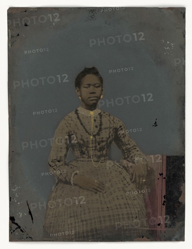 Tintype of a seated young woman, 1850-1875. Creator: Unknown.