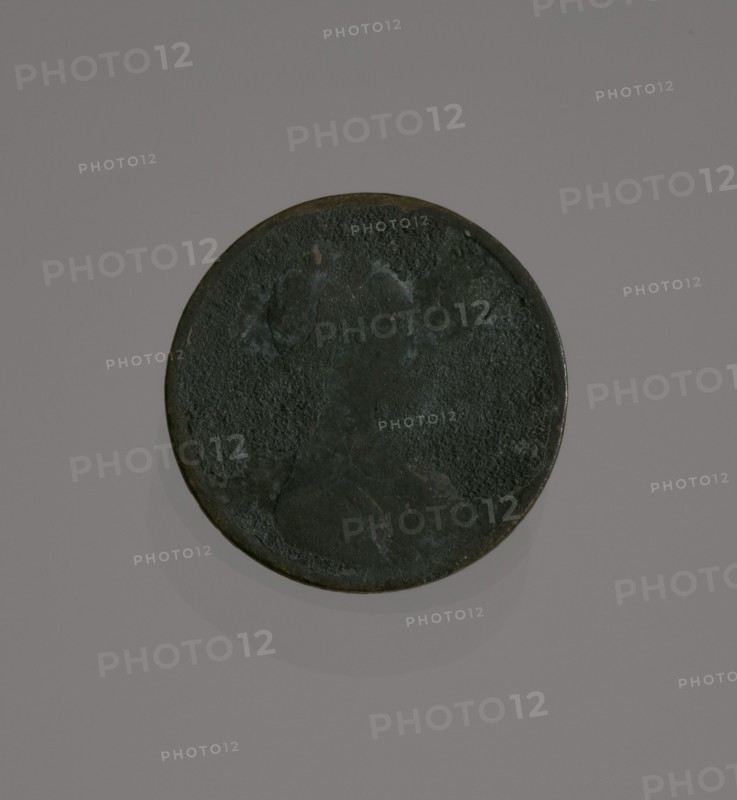 Riot penny charred during the 1921 Tulsa Race Massacre, 1909-1921. Creator: United States Mint.