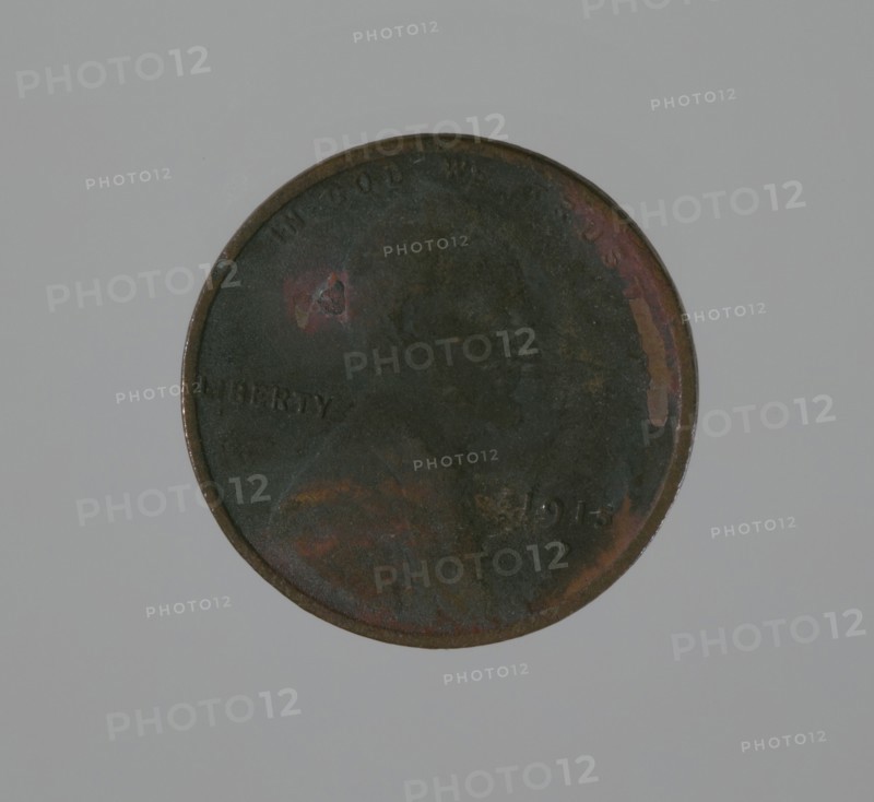 Riot penny charred during the 1921 Tulsa Race Massacre, 1915. Creator: United States Mint.