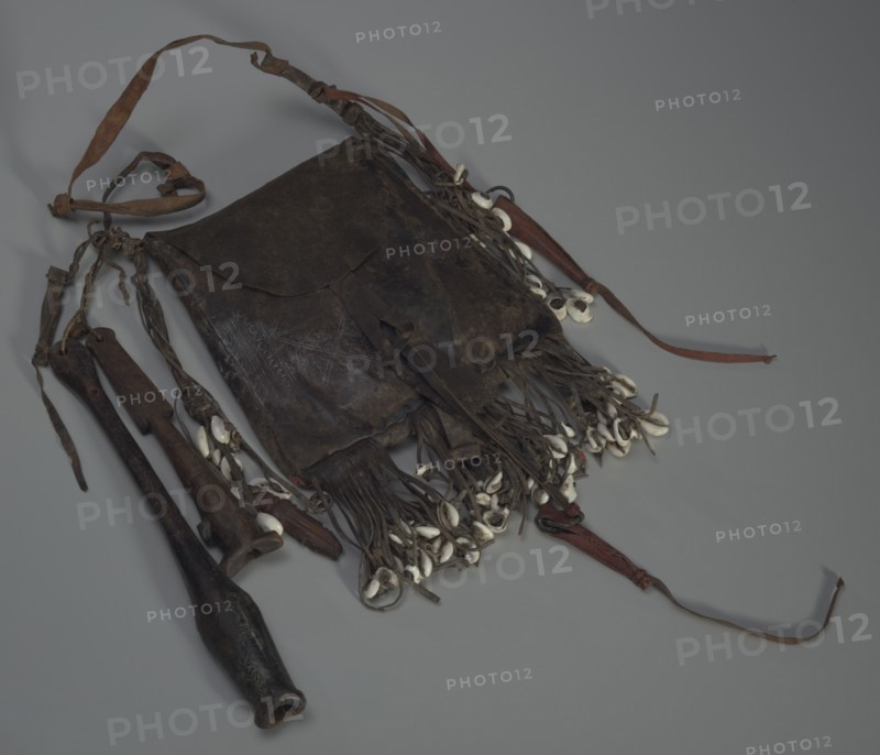 Leather bag with tools, whistles, and shells, 20th Century. Creator: Unknown.