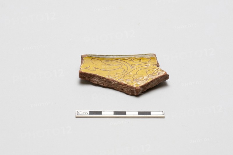 sherd, red body, white slip, yellow glaze, Mamluk period, 1250-1517. Creator: Unknown.