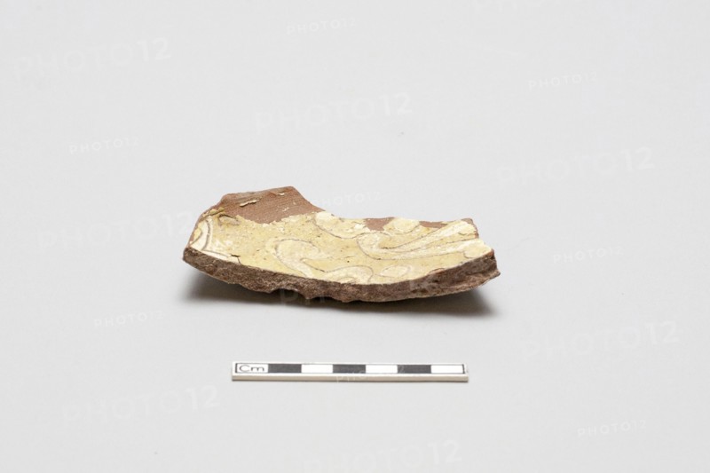 sherd, red body, white slip, yellow glaze, Mamluk period, 1250-1516. Creator: Unknown.