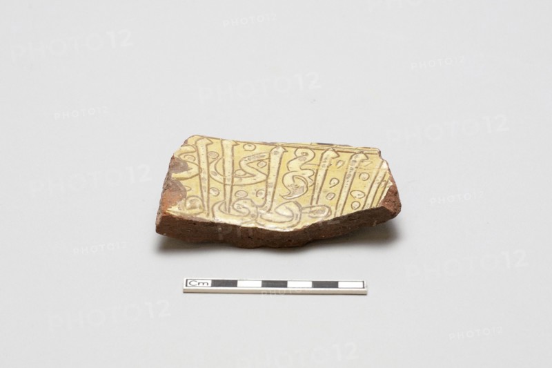 sherd, red body, white slip, yellow glaze, Mamluk period, 1250-1516. Creator: Unknown.