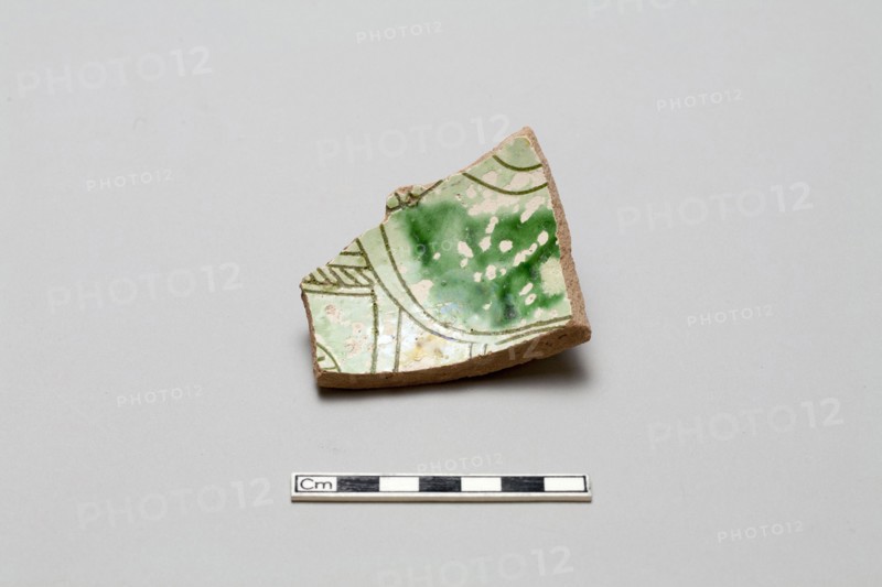 sherd, red body, white slip, green glaze, Mamluk period, 1250-1516. Creator: Unknown.