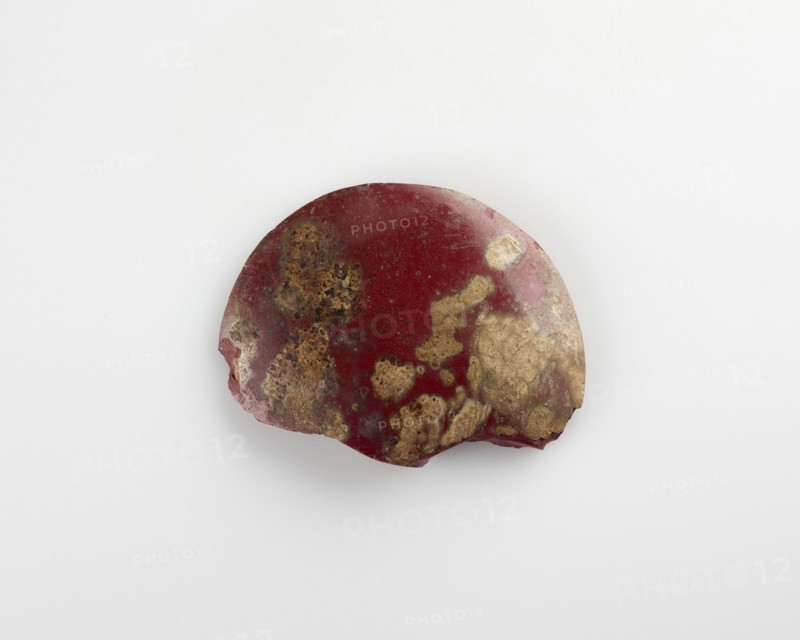 Fragment of a disk inlay; plano-convex, Ptolemaic Dynasty or Roman Period, 305 BCE-14 CE. Creator: Unknown.